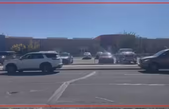 Two fathers charged after violent fight at Albuquerque elementary school pickup